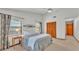 Bright bedroom with a ceiling fan, two windows and a closet with louvered doors at 4120 Chelsea Ln, Lakeland, FL 33809
