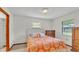 Neutral bedroom featuring a bright comforter, a window and ample natural light at 4120 Chelsea Ln, Lakeland, FL 33809