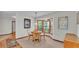 Bright breakfast nook featuring a round table, four chairs, and a bay window at 4120 Chelsea Ln, Lakeland, FL 33809