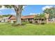 Charming home featuring a well-manicured lawn and lovely landscaping at 4120 Chelsea Ln, Lakeland, FL 33809