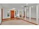 Bright Foyer featuring hardwood floors, a bench, and large mirrored wall at 4120 Chelsea Ln, Lakeland, FL 33809