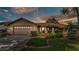 Charming single Gathering home with a well-manicured lawn, beautiful landscaping, and a two car garage at 4120 Chelsea Ln, Lakeland, FL 33809
