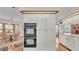 Bright kitchen view of stainless double oven and extra cabinets at 4120 Chelsea Ln, Lakeland, FL 33809