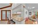 The open-concept design connects the breakfast bar, kitchen, and breakfast nook, creating a harmonious living space at 4120 Chelsea Ln, Lakeland, FL 33809