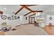 Open-concept living room with vaulted ceiling and a view of the kitchen and patio at 4120 Chelsea Ln, Lakeland, FL 33809