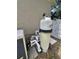 Close-up of the pool filter and equipment, showing the connections and setup beside the house at 15917 Mercott Ct, Clermont, FL 34714