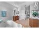 Bright bathroom featuring a soaking tub, double vanity, and ceramic tile at 4013 Greystone Dr, Clermont, FL 34711