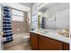 Bathroom featuring a single vanity, tub-shower combo, and ceramic tile at 4013 Greystone Dr, Clermont, FL 34711