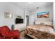 Bedroom featuring a plush bed, dresser with television, and neutral paint at 4013 Greystone Dr, Clermont, FL 34711