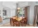 The dining area features a wood table with seating for six at 4013 Greystone Dr, Clermont, FL 34711