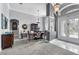 Elegant dining room with stylish lighting, neutral color palette, and ornate furnishing at 4013 Greystone Dr, Clermont, FL 34711