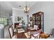 Sophisticated dining room featuring a dark wood table set for six and display cabinet at 4013 Greystone Dr, Clermont, FL 34711