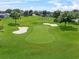 Overhead view of golf course with green, sand traps and the word 'LEGENDS' displayed at 4013 Greystone Dr, Clermont, FL 34711