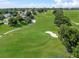 Expansive golf course with meticulously maintained greens, sand traps, and scattered trees at 4013 Greystone Dr, Clermont, FL 34711