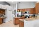 Well-equipped kitchen with an island, stainless steel appliances, and wood cabinets at 4013 Greystone Dr, Clermont, FL 34711