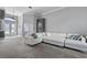 Bright living room featuring a white sectional sofa and high ceilings at 4013 Greystone Dr, Clermont, FL 34711