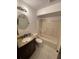 Bathroom featuring a vanity with a granite countertop and a shower-tub combo, perfect for relaxation and convenience at 507 Cloudcroft Dr, Deltona, FL 32738