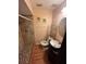 Small bathroom with tiled shower and round sink at 507 Cloudcroft Dr, Deltona, FL 32738