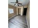 A bedroom features modern flooring, a ceiling fan, and a built-in closet at 507 Cloudcroft Dr, Deltona, FL 32738