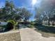 Charming single-story home with a long driveway and mature trees at 507 Cloudcroft Dr, Deltona, FL 32738