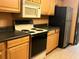 Functional kitchen featuring classic appliances, ample cabinetry, and durable countertops at 507 Cloudcroft Dr, Deltona, FL 32738
