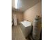 Functional laundry room with modern washer, dryer, and water heater, streamlining chores for convenience at 507 Cloudcroft Dr, Deltona, FL 32738