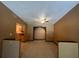 Spacious living room with tile flooring, neutral paint, and an arched doorway to the kitchen at 507 Cloudcroft Dr, Deltona, FL 32738