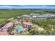 Expansive aerial view showcasing condos with a resort-style pool area and manicured landscaping at 8601 Worldquest Blvd # 3404, Orlando, FL 32821