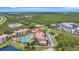 Picturesque aerial view of the condos featuring a large community pool and well-maintained grounds at 8601 Worldquest Blvd # 3404, Orlando, FL 32821