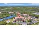 Sprawling aerial view of condos by a tranquil lake with lush greenery and beautiful surroundings at 8601 Worldquest Blvd # 3404, Orlando, FL 32821