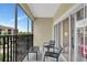 Screened balcony offering comfortable seating and pleasant views of the surrounding neighborhood at 8601 Worldquest Blvd # 3404, Orlando, FL 32821