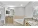 Bathroom boasts a large soaking tub, granite countertops, and updated cabinetry at 8601 Worldquest Blvd # 3404, Orlando, FL 32821