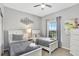 Charming bedroom with two twin beds, neutral decor, and ample natural light from the window at 8601 Worldquest Blvd # 3404, Orlando, FL 32821