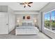 Serene bedroom features a plush bed, large window, and ample closet space for comfortable living at 8601 Worldquest Blvd # 3404, Orlando, FL 32821