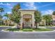 Stately building entrance with lush landscaping, covered entry, and attractive architectural details at 8601 Worldquest Blvd # 3404, Orlando, FL 32821