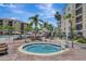 Relaxing hot tub area surrounded by lush greenery at 8601 Worldquest Blvd # 3404, Orlando, FL 32821
