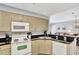 Well-equipped kitchen featuring modern appliances and cabinetry, complemented by stylish countertops and ample storage at 8601 Worldquest Blvd # 3404, Orlando, FL 32821