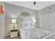 Inviting bedroom with a ceiling fan, queen bed, neutral colors, and a double-door closet at 8601 Worldquest Blvd # 3404, Orlando, FL 32821
