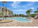 Resort-style pool area with lush landscaping and ample lounge seating at 8601 Worldquest Blvd # 3404, Orlando, FL 32821