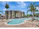 Resort-style pool area with lush landscaping and ample lounge seating at 8601 Worldquest Blvd # 3404, Orlando, FL 32821