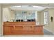 Spacious reception desk featuring tiled art work and warm lighting at 8601 Worldquest Blvd # 3404, Orlando, FL 32821