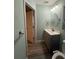 Bathroom with updated vanity, lighting, and mirror at 5641 Nw 55Th Ave, Ocala, FL 34482