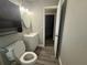 Bathroom with white vanity and updated light fixture at 5641 Nw 55Th Ave, Ocala, FL 34482