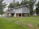 Home's exterior featuring fenced-in yard with partial stilt foundation at 5641 Nw 55Th Ave, Ocala, FL 34482