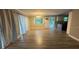 Spacious living room with new laminate flooring and natural light at 5641 Nw 55Th Ave, Ocala, FL 34482