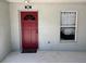 Close-up of the front door and entry of the home, including address number and sidelight window at 888 W Stuart St, Bartow, FL 33830