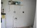 Unfinished utility room with white cinderblock walls and water heater at 888 W Stuart St, Bartow, FL 33830