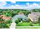 Charming single-story home featuring a lush, landscaped front yard, a concrete driveway, and an attached garage at 17426 Tailfeather Ct, Clermont, FL 34711