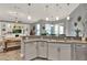 Open kitchen layout with granite counters and stainless steel appliances at 17426 Tailfeather Ct, Clermont, FL 34711