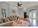 Cozy living room features hardwood floors, high ceilings, and natural light at 17426 Tailfeather Ct, Clermont, FL 34711